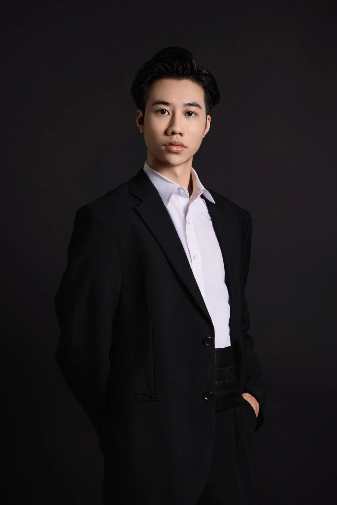 Editorial portrait of a professional in a dark setting