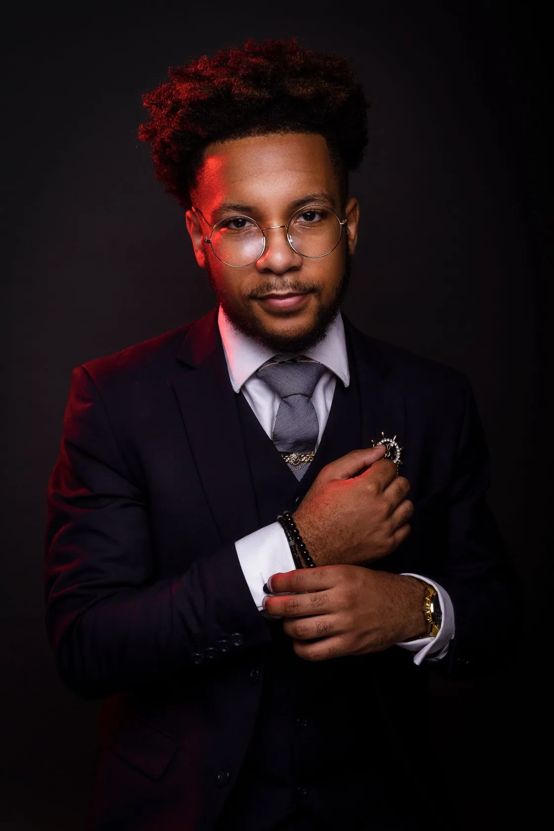 Editorial portrait of a person in a dark setting